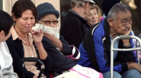 Residents in Culver City, Calif.. wait in line Friday,  to receive their H1N1 swine flu vaccination.