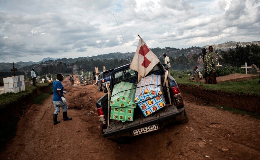 Coffins containing the bodies of two people who died of Ebola are brought to a cemetery in Butembo for burial on May 16. The case count in the 10-month-long outbreak topped 2,000 this week.