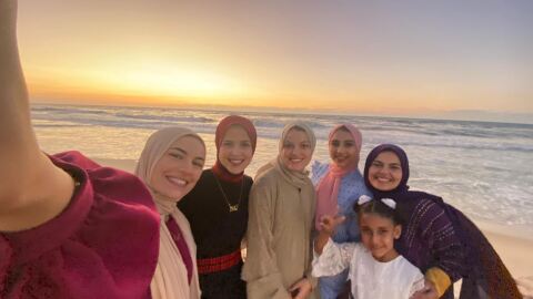 UCSD alum Dania Zanaid stands with her family on a beach in Gaza in this undated photo.