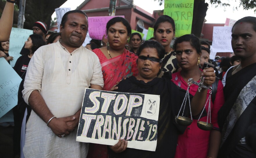 Supporters of lesbian, gay, bisexual and transgender community hold placards during a protest against passing of Transgender Persons (Protection of Rights) Bill, 2019, in Bangalore, India, Wednesday, Nov. 27, 2019. Members of the LGBT community alleged that the bill violated their rights instead of empowering them. The bill was passed in upper house of Indian parliament on Tuesday.