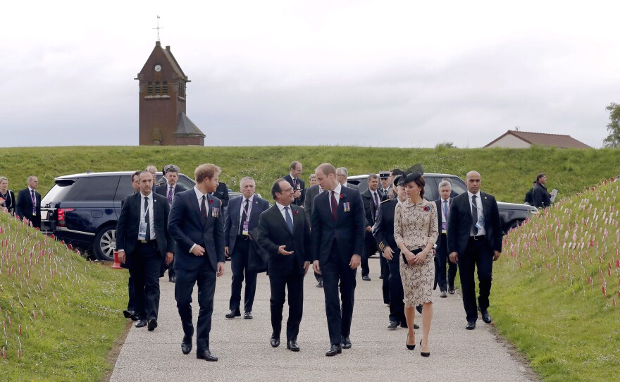 French President Francois Hollande (center left) arrives in Thiepval along with Britain's Prince Harry (left) and Prince William and his wife, Kate, the Duchess of Cambridge, to attend the Somme centenary commemorations.