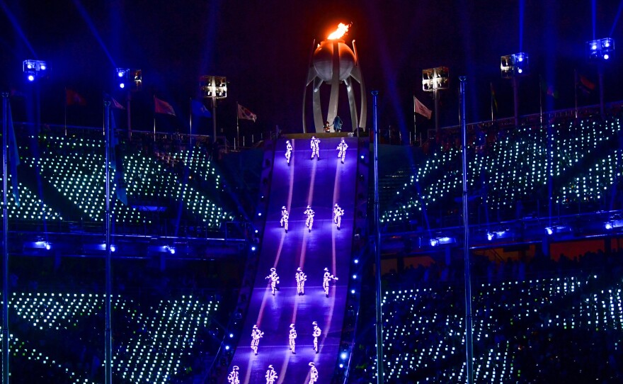 Artists perform near the Olympic flame during the closing ceremony. "Although parting is sad, we will remember Pyeongchang with beautiful memories," said Lee Hee-beom, the Pyeongchang Olympics organizing committee president.