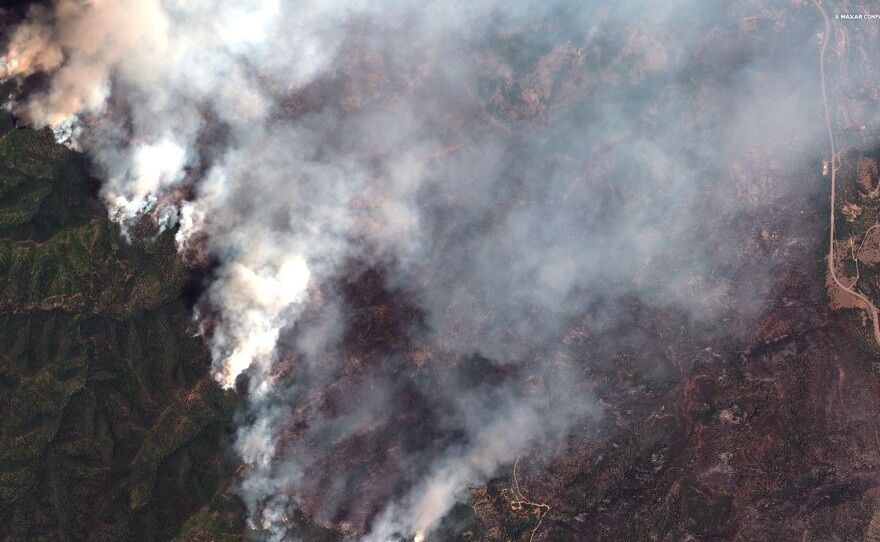 A satellite image provided by DigitalGlobe shows the 416 Fire northwest of Hermosa, Colo., which has forced the closure of the San Juan National Forest.