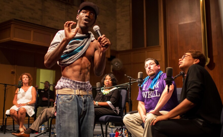 Rev. Willis Johnson (left), pastor of Wellspring Church in Ferguson, speaks to Rev. Michele Shumake-Keller after the panel discussion. Johnson said he hoped the event would be a step to healing a "community in trauma."