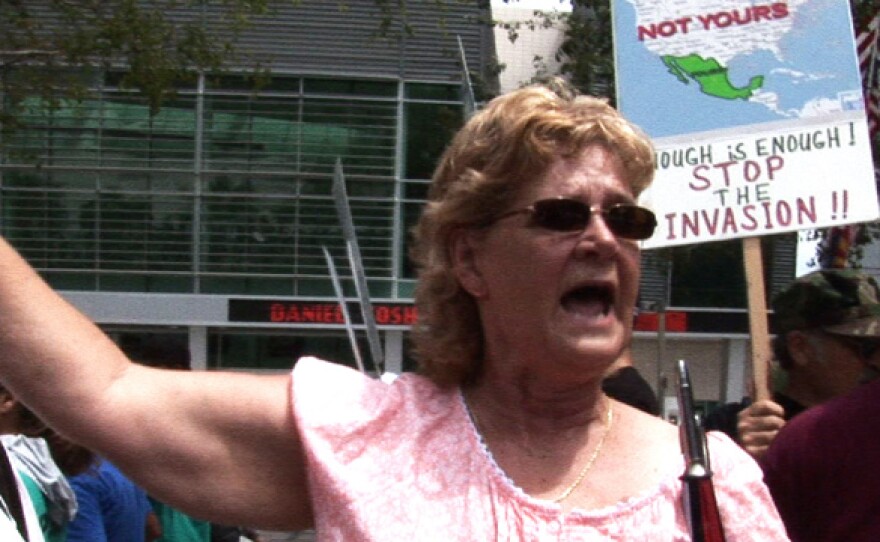 Phoenix area resident Renee Taylor demonstrates in support of SB 1070 outside the federal court house.