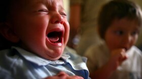 A young boy reacts to receiving a prick from a vaccine. Children can receive up to 13 immunizations by age 2, and many parents worry about possible side effects. But experts say that vaccines are safer and cleaner than before.