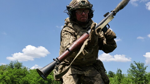 In this photo provided by Ukraine's 65th Mechanized Brigade press service, a soldier practices military skills at a training ground near the frontline in the Zaporizhzhia region, Ukraine, Saturday, June 20, 2026.