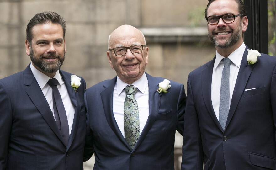 Rupert Murdoch poses with his sons Lachlan (left) and James (right) in London in 2016.