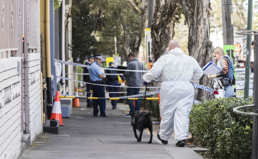 Police at the scene of overnight terror raids in Surry Hills on Sunday in Sydney. Counterterrorism police raided five properties in the city's suburbs on Saturday night and arrested four men over an alleged terror plot that involved blowing up an aircraft.