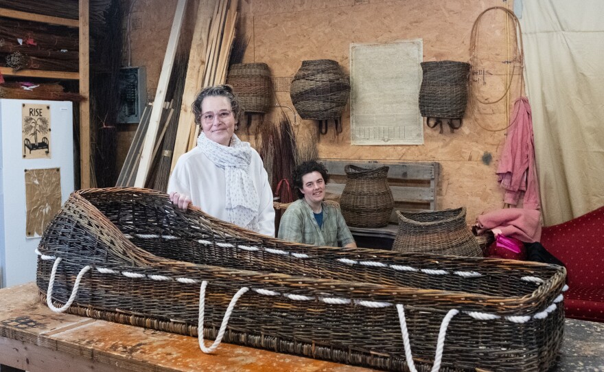 MaddyChristine Hope Brokopp and Mary Lauren Fraser, stand behind Brokopp's completed burial tray.