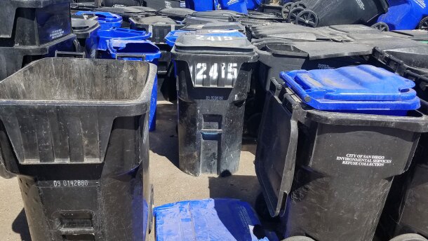 Damaged trash and recycling bins are shown stacked at the Miramar Landfill, Sept. 12, 2019. 