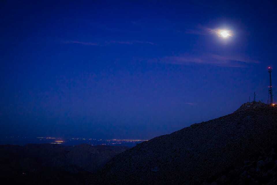 NOT FOR REUSE. The moon rises above the Imperial Valley from along Interstate 8 Highway at In Koh Pah in this undated photo. Credit: Juan Rodelo. NOT FOR REUSE.