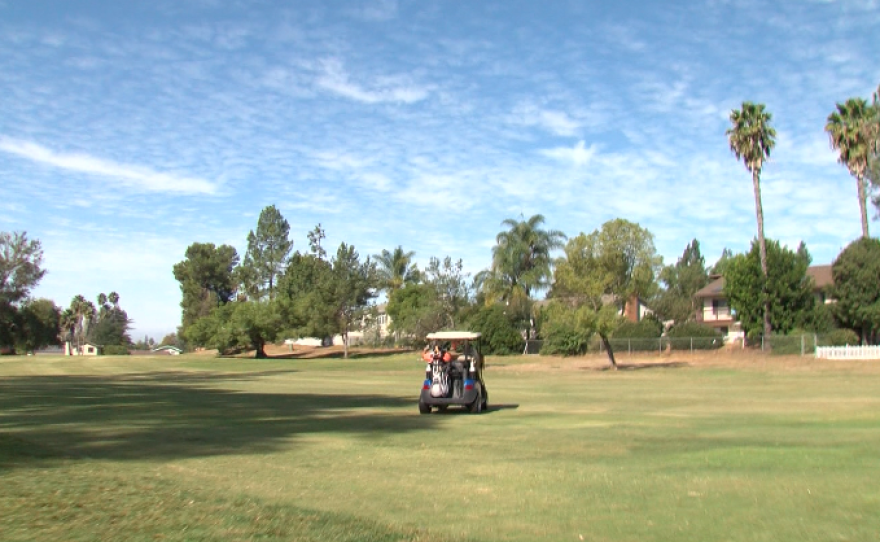 A golf cart sits in the fairway on the south end of the StoneRidge Country Club in Poway, Oct. 10, 2017.