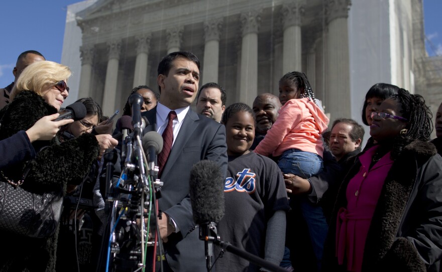 Debo Adegbile, special counsel of the NAACP Legal Defense Fund, speaks with the media outside the Supreme Court in Feb. 2013 after presenting arguments in the Shelby County, Ala., v. Holder voting rights case.
