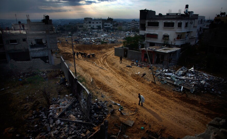 The Twam neighborhood of Gaza lies in ruins as residents try to pick up the pieces on Jan. 19, 2009. A tenuous cease-fire held that day in Gaza, where Palestinians dug out from the rubble.