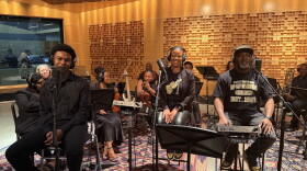Kaleb Cabell, Andrea Coln McNeill and Jeffrey McNeill perform as part of The Illharmonic Orchestra at NPR's Washington headquarters.