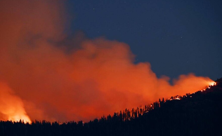 The Washburn Fire burns near the south entrance of Yosemite National Park on July 11 near Oakhurst, Calif.