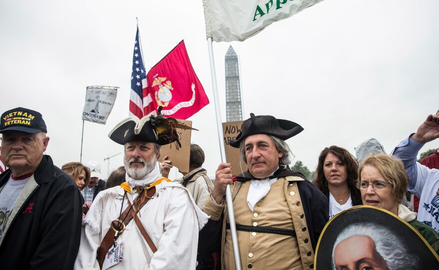 Military veterans, Tea Party activists and Republicans gather in Washington, D.C., on Oct. 13, 2013 to rally for the reopening of national memorials and against then-President Barack Obama during a government shutdown. (Photo by Andrew Burton/Getty Images)