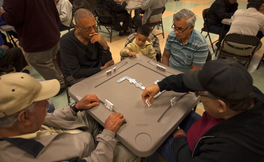 A group of men plays dominoes at the Robert Guevara Community Center in the heart of the Buenaventura Lakes neighborhood in Kissimmee. Today, Florida has replaced New York as the primary destination for Puerto Ricans coming to the mainland.