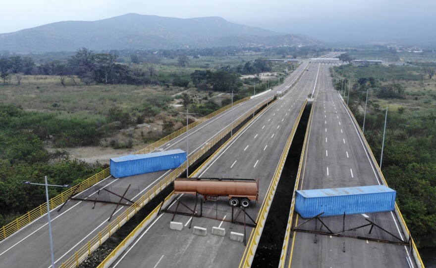 The Tienditas bridge connecting Colombia and Venezuela has been blocked by Venezuelan military forces, as seen here on Wednesday. Opposition leader Juan Guaidó and U.S. Secretary of State Mike Pompeo are demanding that humanitarian aid be allowed to enter.