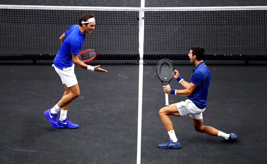 Roger Federer, left, and Novak Djokovic celebrate a point at the Laver Cup in Chicago, Ill., in September 2018.