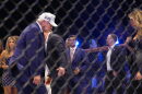 President Donald Trump and first lady Melania Trump stand in the ring at UFC Freedom 250 on the South Lawn of the White House, Monday, June 15, 2026, in Washington.
