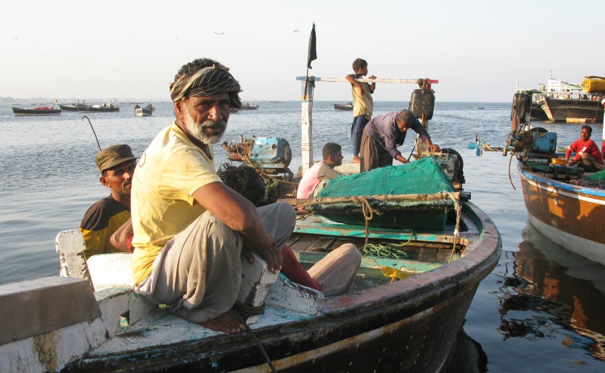 A Gwadar fisherman relaxes as the sun goes down.