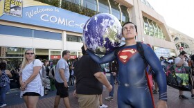 Bersain Gutierrez, dressed as Superman, poses in front of the convention center before Preview Night at Comic-Con International held at the San Diego Convention Center, July 20, 2016.
