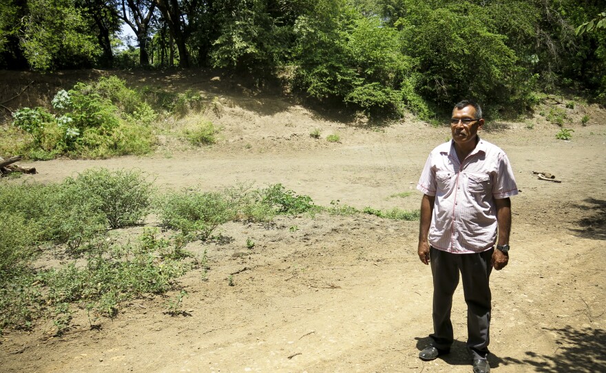 Santos Nicoya Bonillo stands in the dry Brito riverbed. Nicoya heads a farmer's cooperative in Tola, Nicaragua. The proposed canal route is set to start at the mouth of the Brito river on the Pacific Ocean. This is the third year of a major drought in southern Central America.