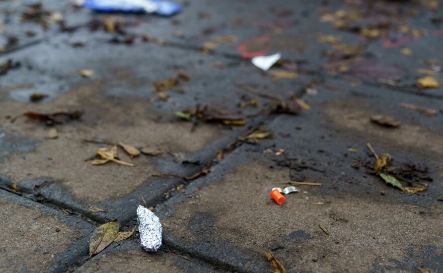 A sidewalk in downtown Portland, Ore., is dotted with tiny scraps of tinfoil, that police say are used for smoking fentanyl.