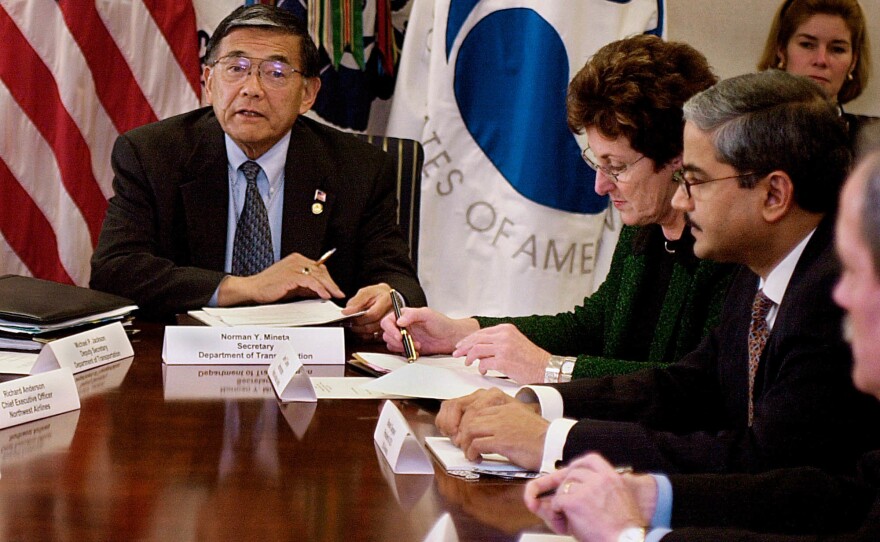 Transportation Secretary Norman Mineta (left) meets with the CEOs of major U.S. airlines, including U.S. Airways CEO Rakesh Gangwal (right), and Federal Aviation Administration Director Jane Garvey on Nov. 15, 2001, at the Department of Transportation in Washington, D.C. Mineta called the meeting to discuss improvements in airport security.