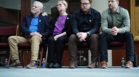 The family of Renee Good, from left; father Tim Ganger, mother Donna Ganger, brother Luke Ganger and brother Brent Ganger, listen during a news conference after the family sued the U.S. government and several immigration officials, Thursday, Oct. 1, 2026, in Minneapolis.