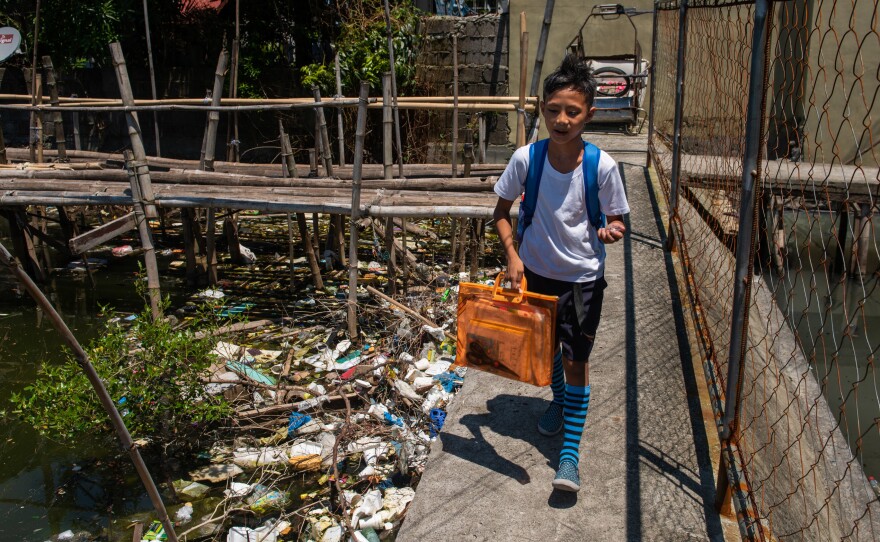 Around the globe, people are searching for ways to reduce plastic waste. Above: Dampalit, a fishing community in Manila Bay, can't keep up with a constant influx of trash.