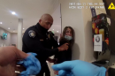 Carlsbad police arrest a woman in the lobby of a hotel, April 10, 2021.