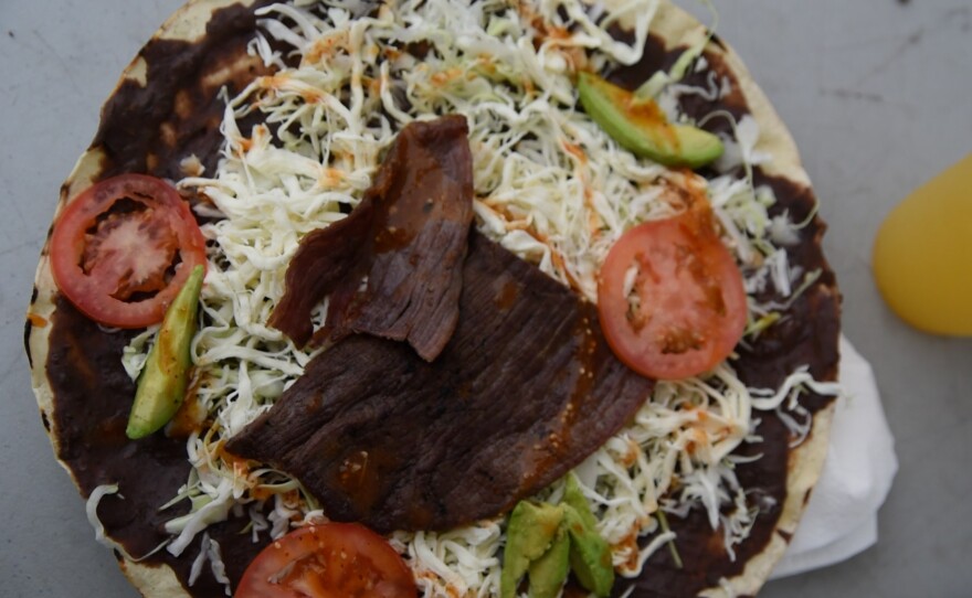 Local vendors offered traditional Oaxacan foods like tlayudas: large toasted tortillas with spiced black beans, a type of Oaxacan cheese called Quesillo, cabbage, salsa and varieties of meat a an event in Valley Center, California on September 21, 2025. <br/><br/>