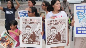 SB 1070 protesters gather outside the federal courthouse in Phoenix. 