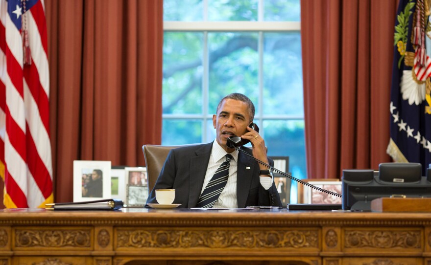 President Obama talks with President Hassan Rouhani of Iran during a phone call in the Oval Office, Sept. 27, 2013.