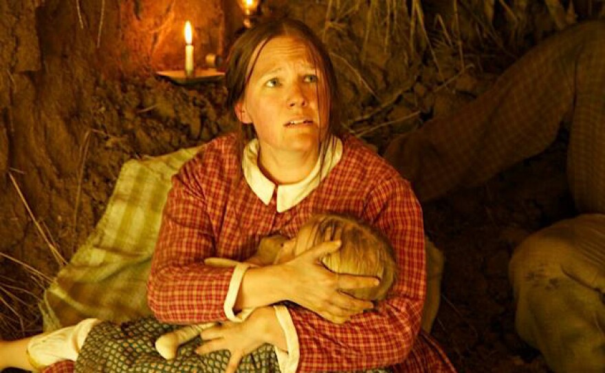 Citizens of Vicksburg were trapped inside the city while besieged by Grant's forces. Like many, Mary Loughbourgh and her young daughter, sought shelter from the relentless bombardment in caves built in the side of hills. This photo is from a reenactment scene filmed for the Siege of Vicksburg.