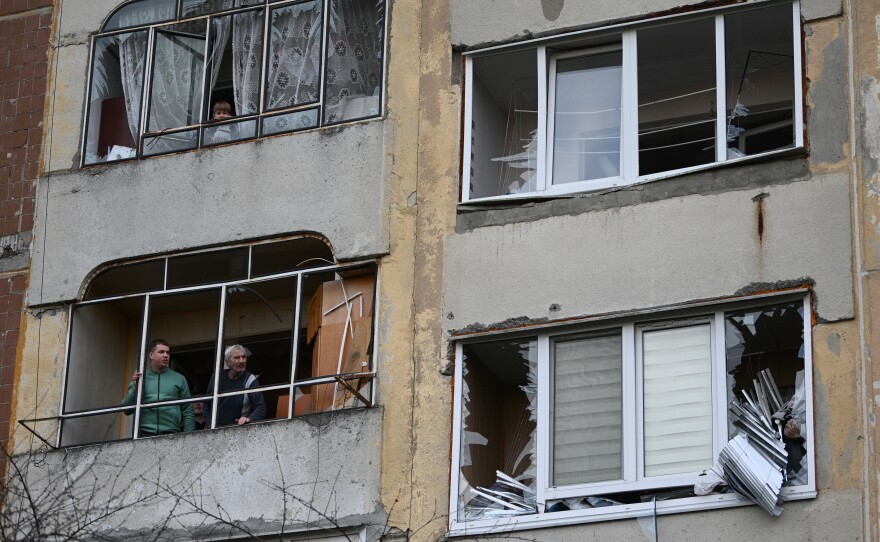 Lviv: Local residents stand inside a damaged building after a missile attack in Lviv, on December 29, 2023, amid the Russian invasion of Ukraine.