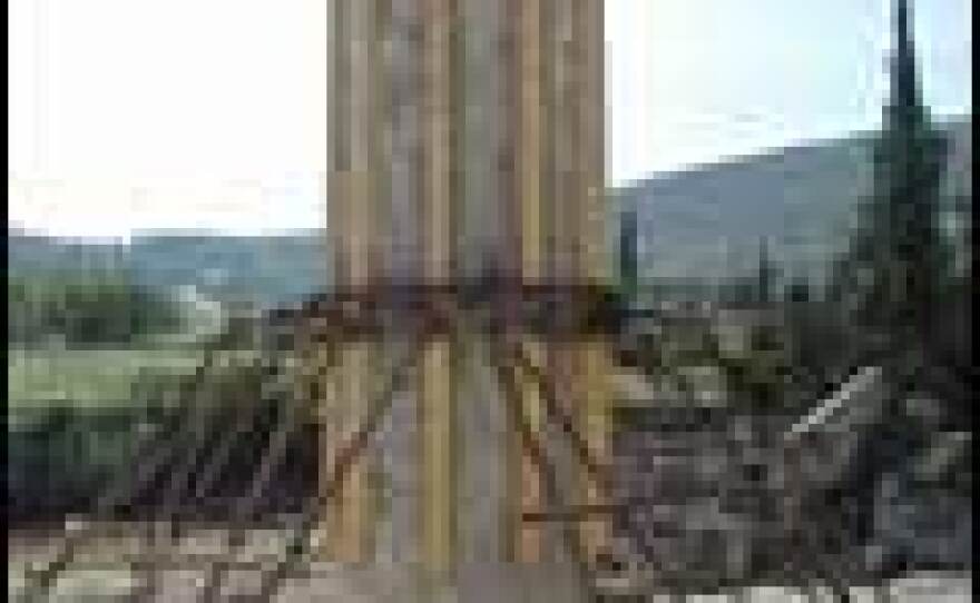 A rebuilt column of Nemea's Temple of Zeus, supported by wooden and metal struts.
