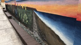 A mural by Amanda Kachadoorian is intedned to evolve images of the south bay without pollution on a wall next to San Ysdiro Blvd. 