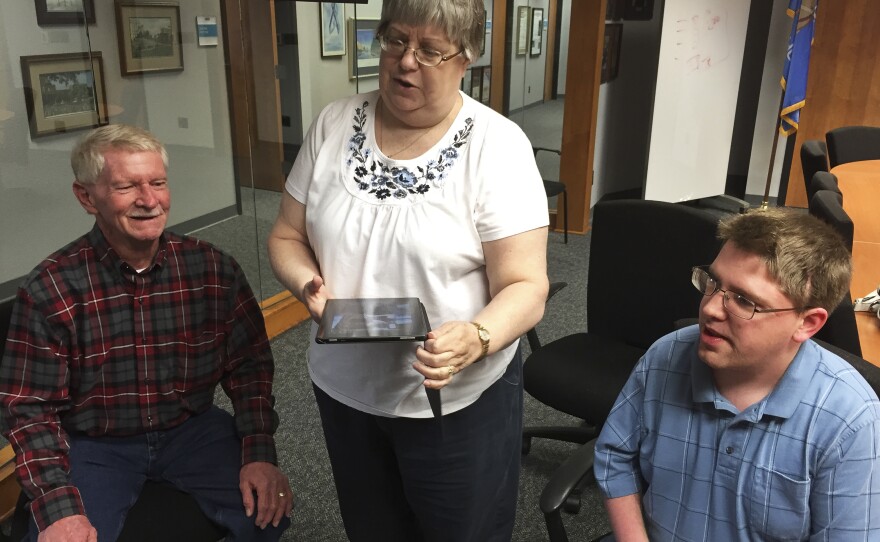 Claudia Denny (center), her husband, Jim (left), and their son Brandon, who was in the day care center at the Murrah building during the bombing.