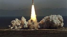 The space shuttle Challenger lifts off from Kennedy Space Center in Florida on Jan. 28, 1986, in a cloud of smoke with a crew of seven aboard. The shuttle exploded shortly after this photo.