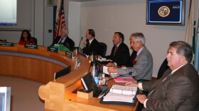 
Oceanside’s newly elected city councilman Chuck Lowery joins the council dais (second from right).  Also shown, from left : councilwoman Esther Sanchez,  city manager, Steven Jepson, mayor Jim Wood and councilman Jack Feller. Dec 3, 2014  