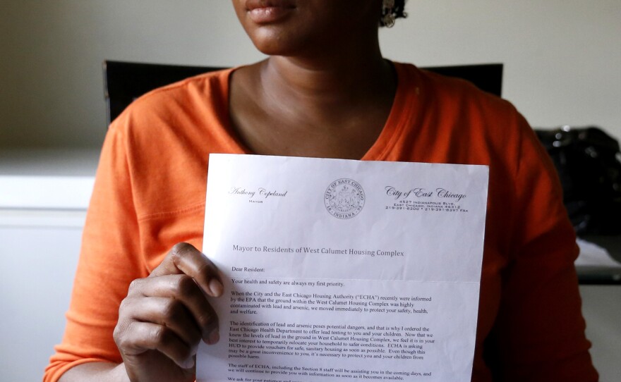 Sherry Jackson shows a letter telling her she must relocate from her West Calumet Housing Complex home in East Chicago, Ind. Jackson has lived at West Calumet Housing Complex for four years but will have to move since the city has decided to demolish complex.