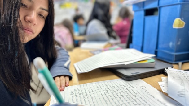 Sofia Cach, 11, uses cursive writing in preparing an essay about New Year's resolutions for her language arts class at Millennial Tech Middle School, San Diego, Calif., January 10, 2024