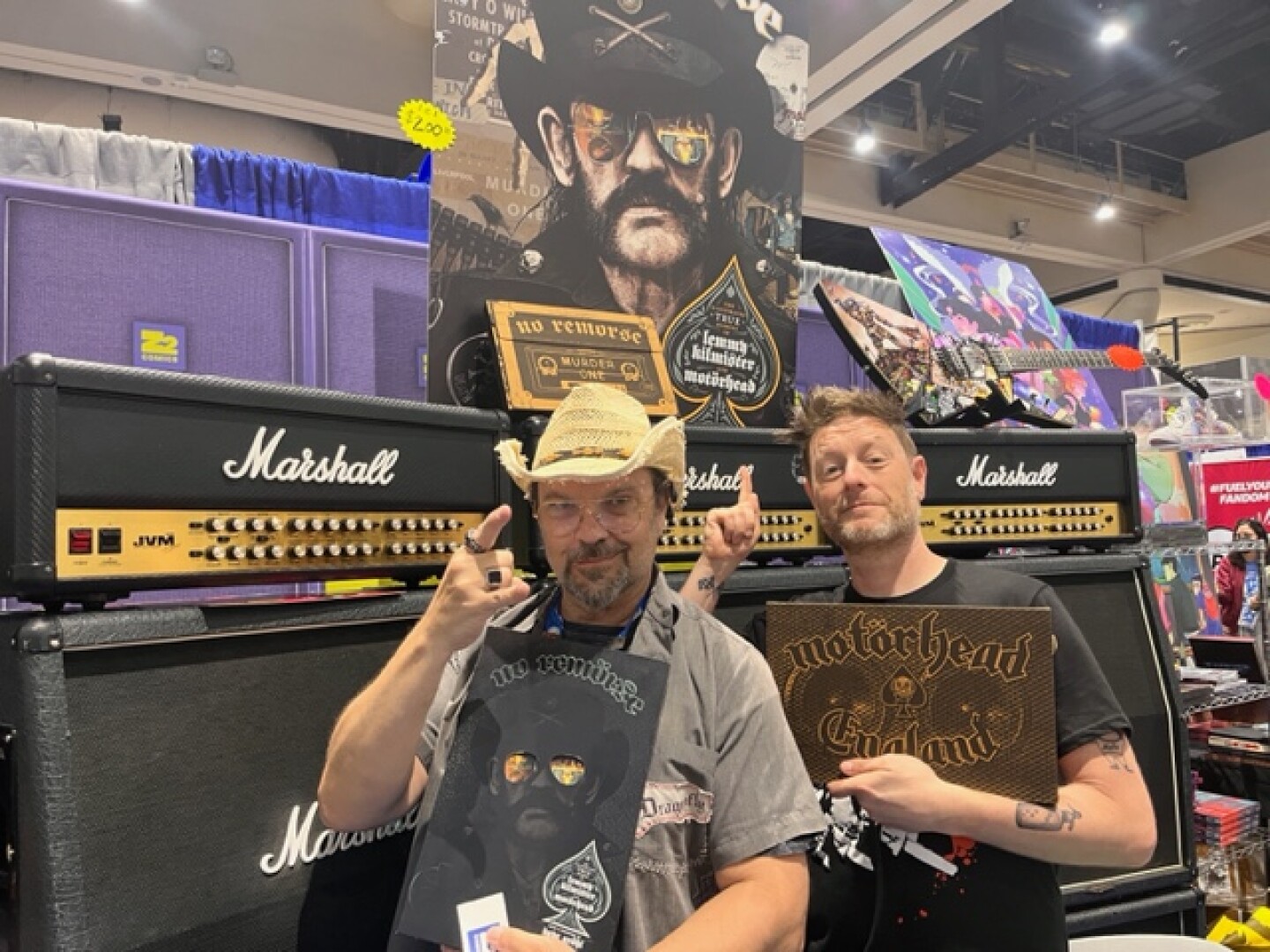 Rantz Hoseley and Josh Bernstein of Z2 Comics pose with their new book, "No Remorse: The Illustrated True Stories of Lemmy Kilmister and Motörhead," on July 28, 2024 at the San Diego Convention Center.