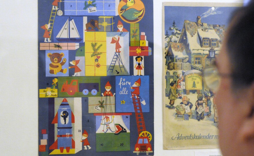 A visitor looks at an Advent calendar from 1966 of the former East Germany at a 2008 museum exhibit in Leipzig.