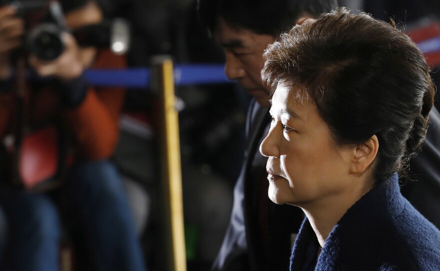 South Korea's ex-leader Park Geun-hye arrives at the prosecutor's office for questioning, in Seoul, on March 21, where she apologized to the people for her role in the corruption scandal that led to her impeachment.