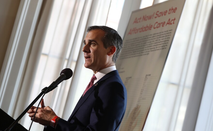 Los Angeles Mayor Eric Garcetti speaks during a town hall on the Affordable Care Act in Los Angeles on Feb. 22. Garcetti said he's trying to quell fears stoked in the city's immigrant communities by President Trump's calls for more cooperation between local law enforcement and federal immigration authorities.